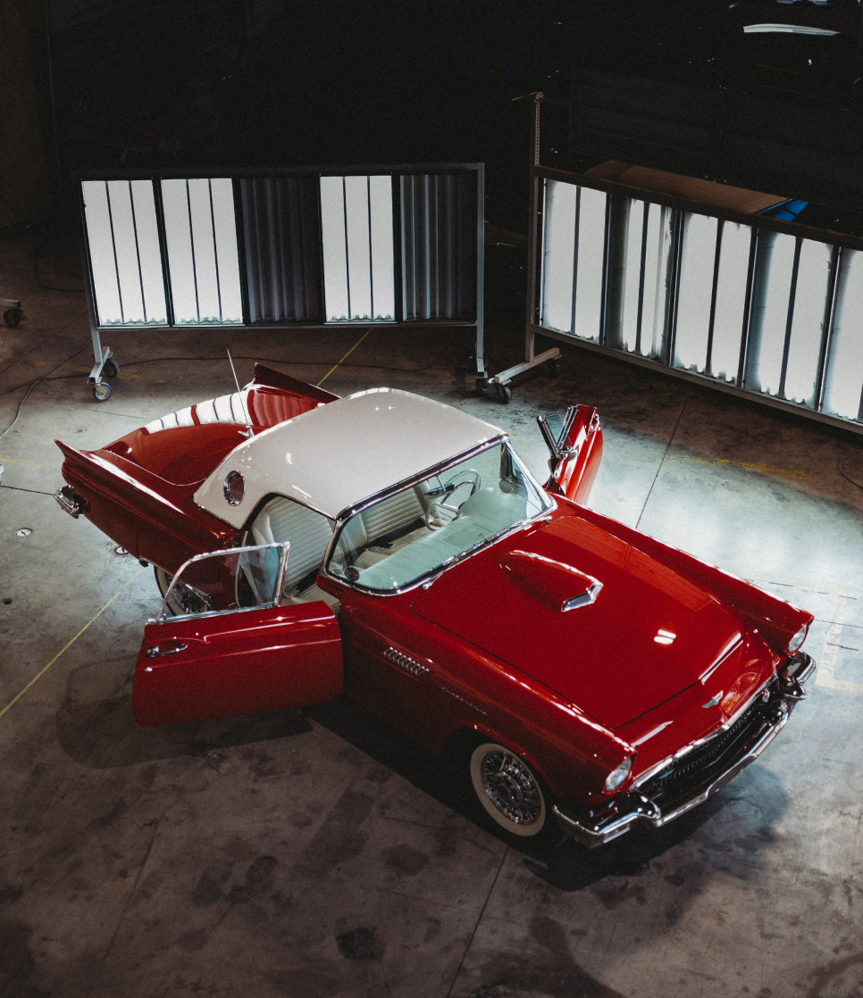 Red Classic car with doors open in the photography studio