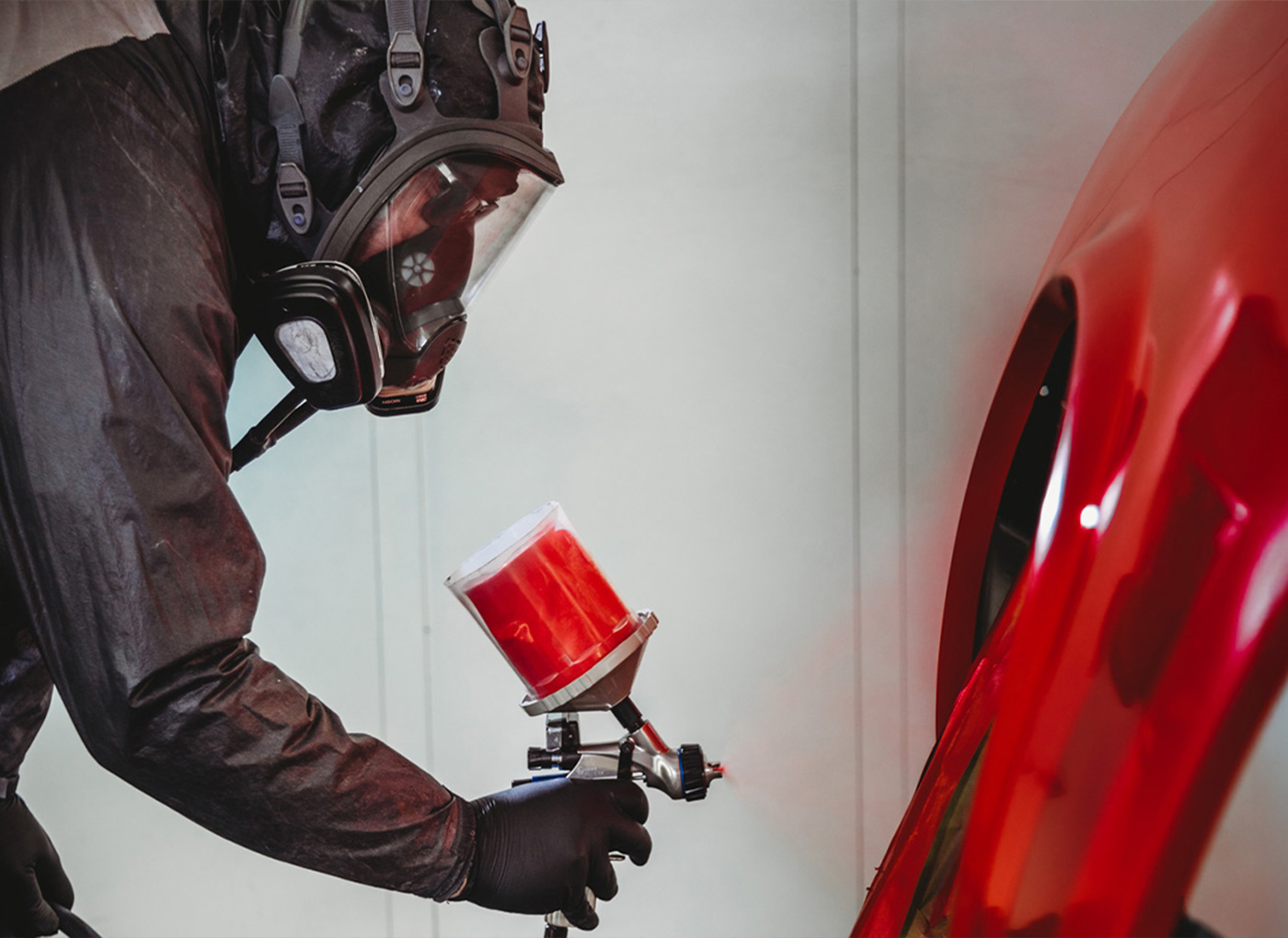 Painting red car in the booth