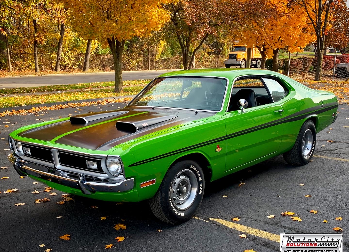 Angled view of a red Hot Rod parked inside the shop
